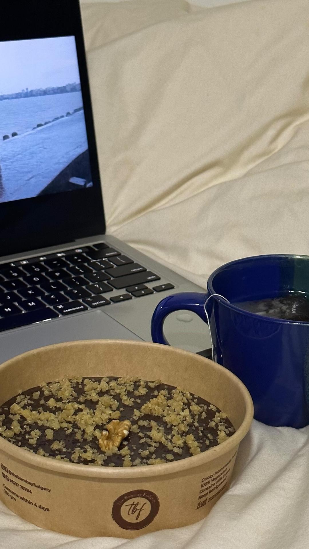 Fudge bowl with chai and laptop on a rainy Bombay day