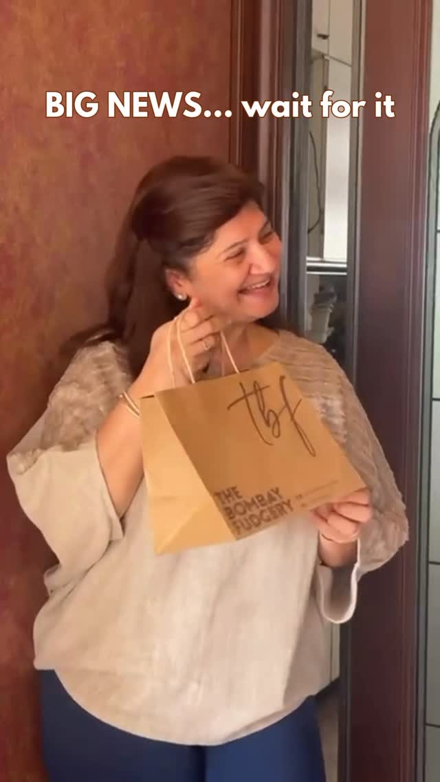 Purvi Kapashi, founder of The Bombay Fudgery, holding a TBF bag